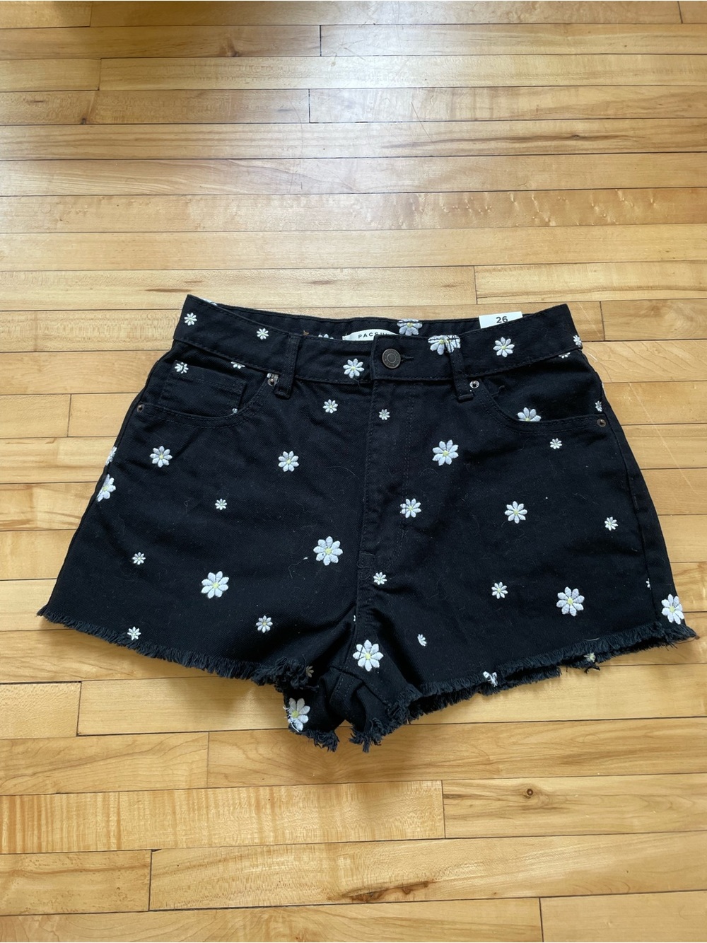 PacSun high-rise festival denim shorts feature an all-over daisy embroidery